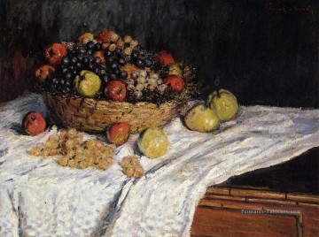 Corbeille de fruits aux pommes et aux raisins Claude Monet Peinture à l'huile